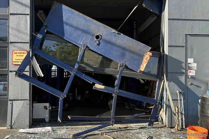 Car repair shop’s bay door badly damaged in theft of vehicle