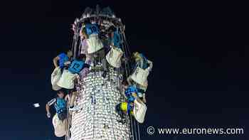 Climbers race up giant bun tower at Hong Kong’s colourful Bun Festival
