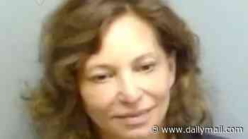 Smiling female teacher, 55, is arrested for sexually abusing 16-year-old at her high school