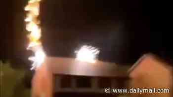 Moment lightning bolt strikes home during thunderstorm - sparking devastating blaze