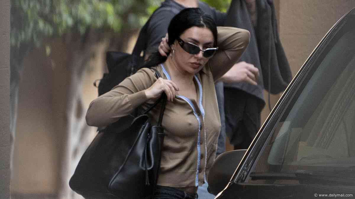 Charli XCX and The 1975's drummer George Daniel touch down in Sicily as the couple lead the stars arriving for Dua Lipa and Callum Turner's lavish £1.5million nuptials