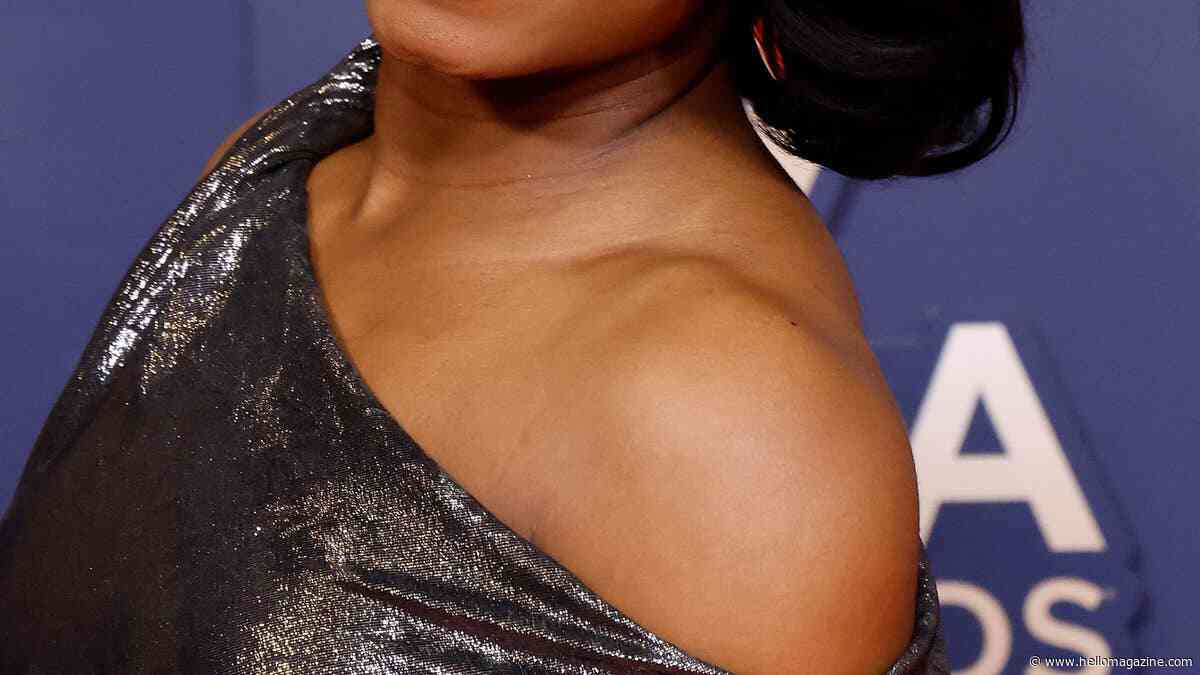 Simone Biles flaunts toned physique in tiny red bikini for impressive trampoline-set gymnastics performance