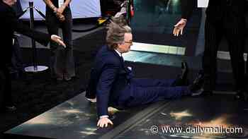 Screenwriter David Koepp, 62, suffers huge blunder as he falls over in front of Emily Blunt at the UK premiere of Disclosure Day