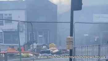 Smoke smothers street after huge waste fire erupts in Bury