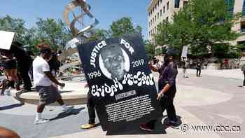 Colorado court overturns homicide convictions of 2 paramedics in death of Black man pinned by police