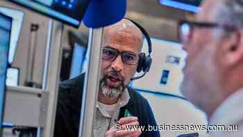 Wall St ends mixed as chip sell-off weighs on Nasdaq