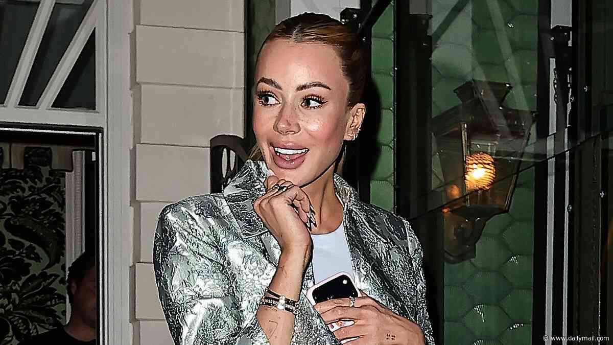 Olivia Attwood accessorises her mini skirt with her favourite £26k designer bag and fun, feathered heels as she joins Nicky Hilton at ALICE + OLIVIA charity fashion dinner