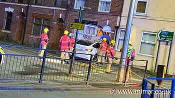Chaos as Tesla ploughs into Wigan house and 999 crews flood street as two injured