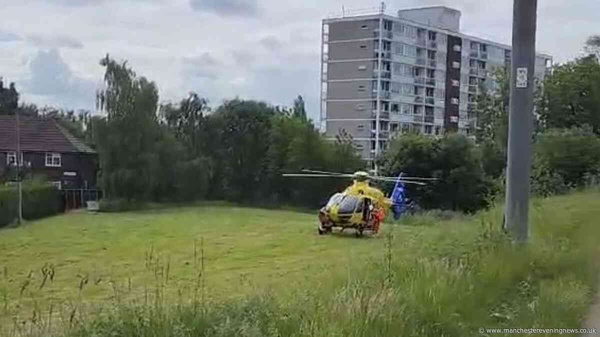 Wythenshawe crash LIVE updates as air ambulance lands and road closed near Metrolink