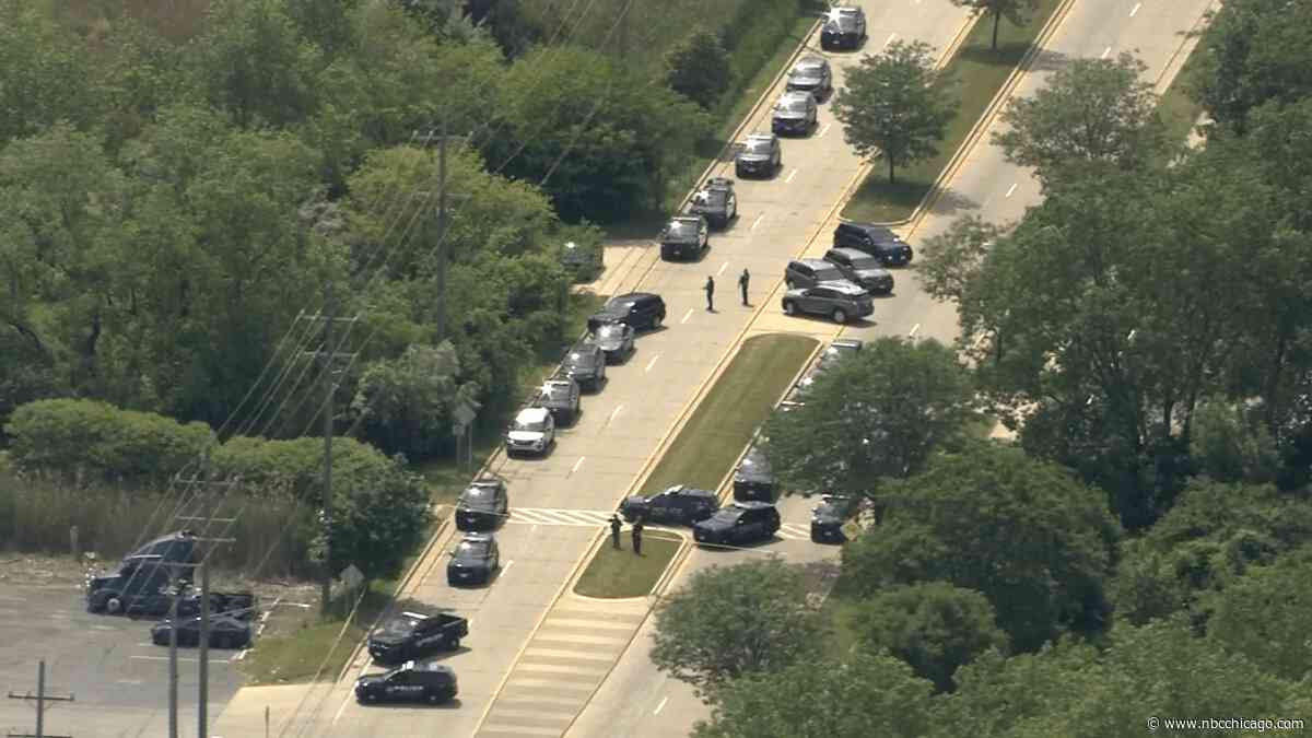 Manhunt continues after fatal shooting at automotive paint shop in suburban Lansing