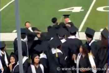 Wild brawl breaks out between cap-and-gown-wearing seniors as names are being called at their graduation