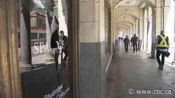 Cracked tiles and broken glass. Former downtown Calgary Hudson's Bay building showing signs of disrepair