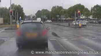 Footage shows dramatic police chase as stolen car races through red lights in Manchester