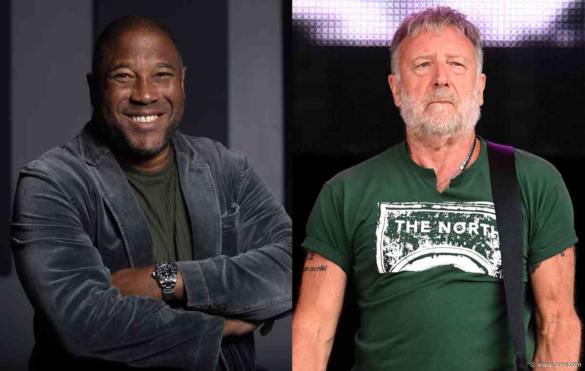 Watch John Barnes join Peter Hook to rap on New Order’s ‘World In Motion’ in Manchester