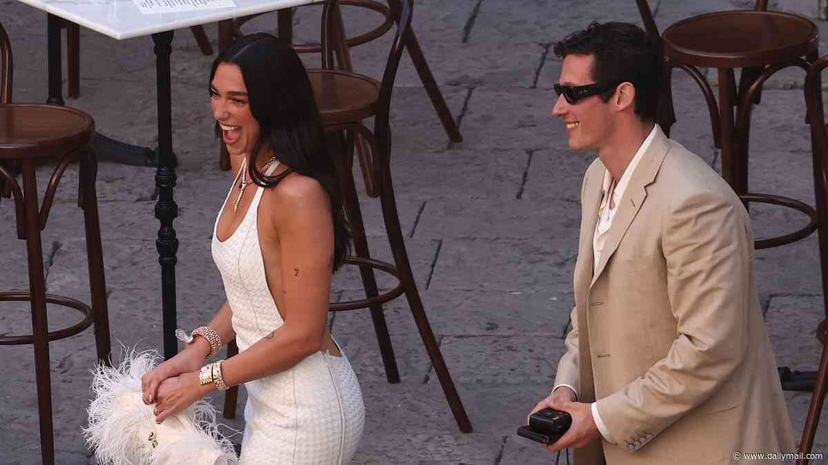 Dua Lipa and Callum Turner's Sicilian nuptials begin! Actor admires his wife's bridal white gown and leans in for a kiss at their star-studded cocktail party with Charli XCX and Mark Ronson in attendance