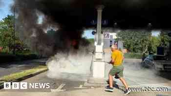 Rare muscle car 'erupts' in flames at petrol station