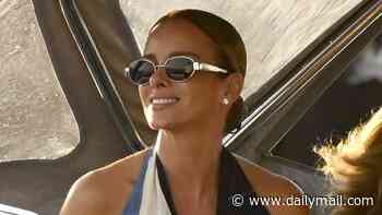Michael Jordan's wife Yvette Prieto shows off her stunning figure in halterneck dress as pair hop off $155m yacht for dinner at celebrity hotspot in Mykonos