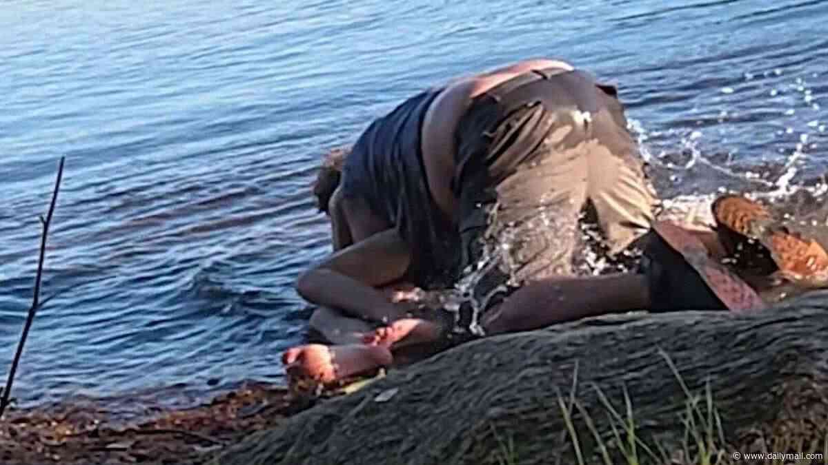 Raging Massachusetts man, 70, filmed trying to DROWN jet ski user, 21, during violent fight over access to upscale community's lake