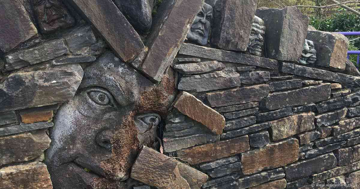 Welsh street decorated with eerie stone heads staring out at bypassers