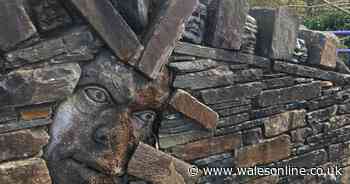 Welsh street decorated with eerie stone heads staring out at bypassers