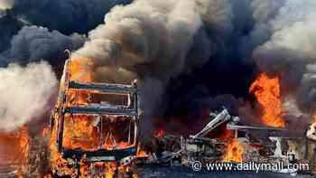 More than 30 double-decker buses go up in flames at depot as police launch arson investigation