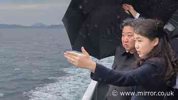 Kim Jong Un parades teen successor daughter around naval destroyer as he reveals nuclear warship plans