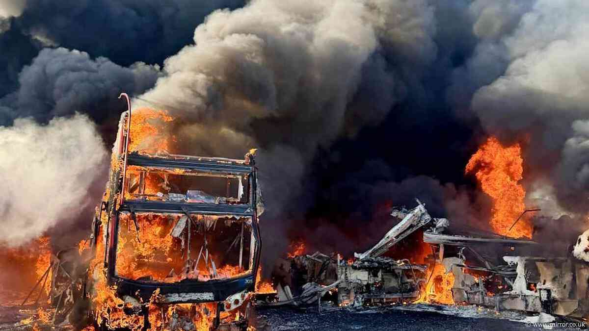 Massive blaze destroys dozens of buses destroyed in suspected arson attack