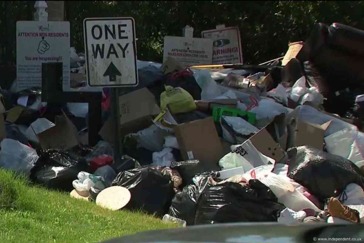 A broken trash compactor has left one Georgia neighborhood piled under garbage