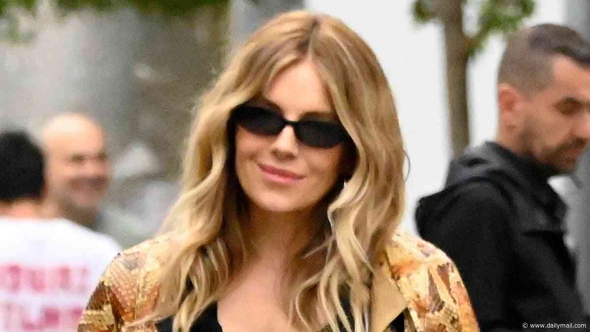 Sienna Miller shows off sparkling new diamond ring in Barcelona - fuelling speculation she is engaged for a fourth time