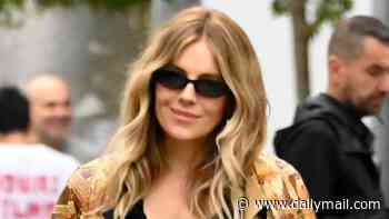 Sienna Miller shows off sparkling new diamond ring in Barcelona - fuelling speculation she is engaged for a fourth time