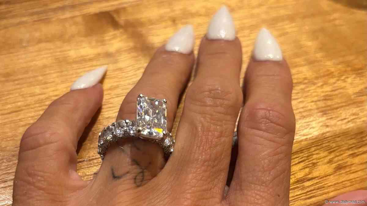 Katie Price declares her love for Lee Andrews and puts her wedding ring BACK ON days after her explosive meeting with husband's ex Dina Taji in Dubai