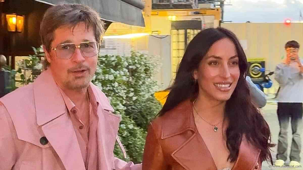 Brad Pitt, 62, steals the spotlight from girlfriend Ines de Ramon, 33, in a bold pink coat as couple continue romantic weekend in Paris with cosy dinner date