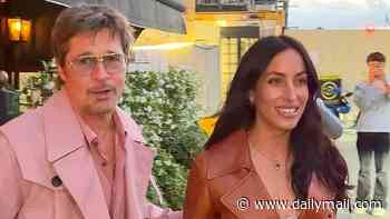 Brad Pitt, 62, steals the spotlight from girlfriend Ines de Ramon, 33, in a bold pink coat as couple continue romantic weekend in Paris with cosy dinner date
