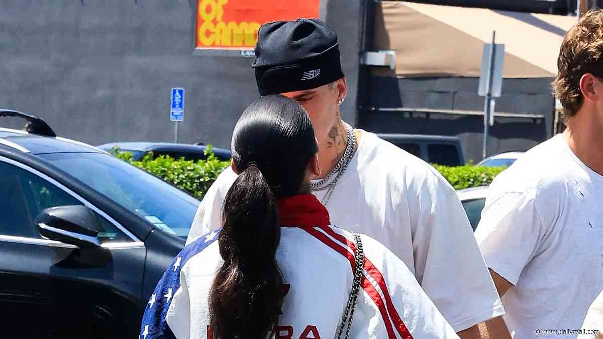 Romeo Beckham kisses girlfriend Kim Turnbull as they surprise fans at LA pop up launch of his new clothing line