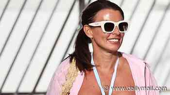 Coleen Rooney is in the party spirit as she hits the beach in a colourful bikini for a kids-free Ibiza break with Wayne... days after nemesis Rebekah Vardy's new TV show was savaged by critics