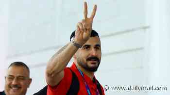 Iraq World Cup star is interrogated for seven hours at Chicago's O'Hare Airport while team's photographer is denied entry to America