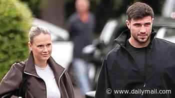 Molly Mae Hague enjoys first outing with Tommy Fury and their newborn baby after 'devastated' boxer was forced to leave his family a day after she gave birth