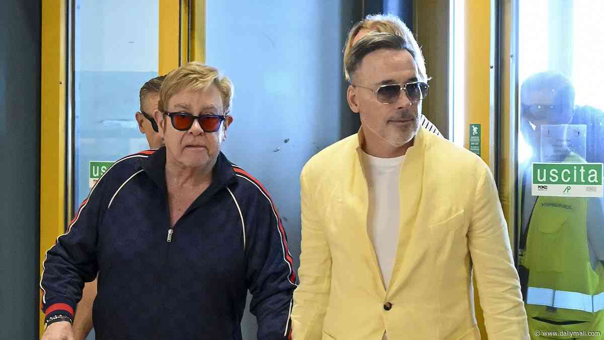 Elton John is frisked by Italian police at the airport ahead of catching a private jet out of Sicily with husband David Furnish - after performing at Dua Lipa and Callum Turner's £1.5m wedding