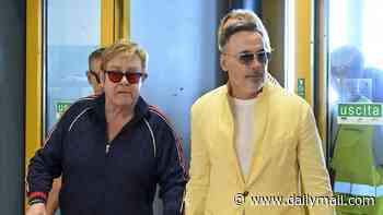 Elton John is frisked by Italian police at the airport ahead of catching a private jet out of Sicily with husband David Furnish - after performing at Dua Lipa and Callum Turner's £1.5m wedding