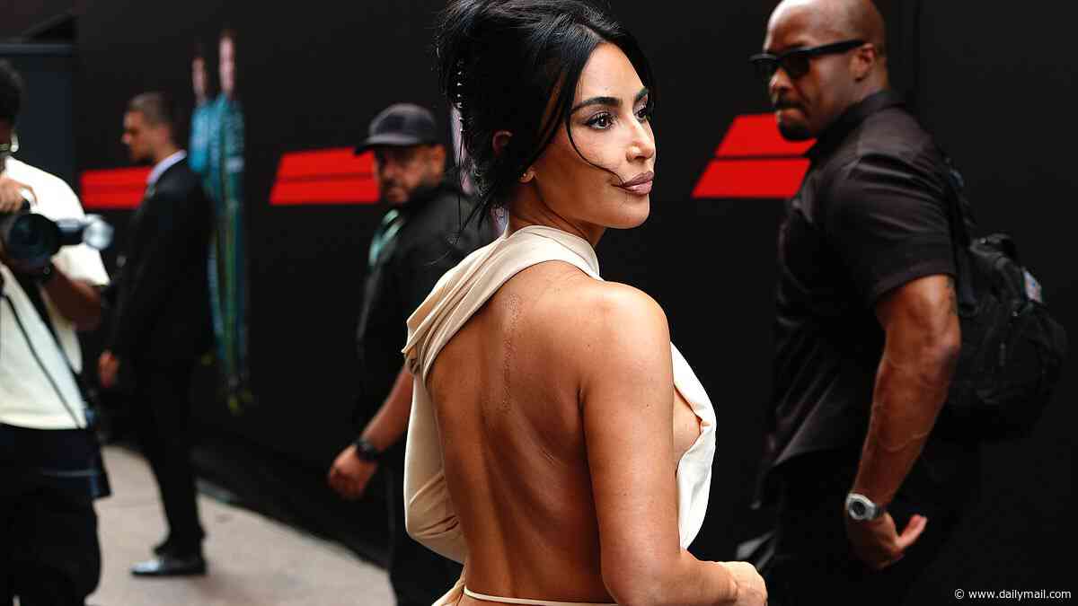Kim Kardashian turns the Monaco Grand Prix into a red carpet in a daring, backless dress as she arrives to cheer on boyfriend Lewis Hamilton alongside celeb F1 fans Catherine Zeta Jones and Michael Douglas