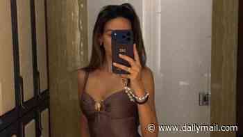 Michelle Keegan poses for a mirror selfie in a chic brown swimsuit as she enjoys lavish weekend at the £1k-a-night Corinthia Hotel in London