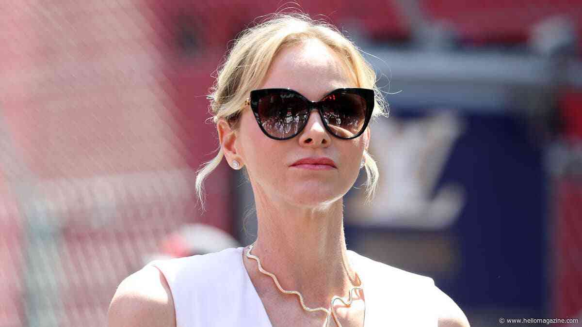 Princess Charlene is a Grecian goddess on the F1 grid in chic V-neck dress