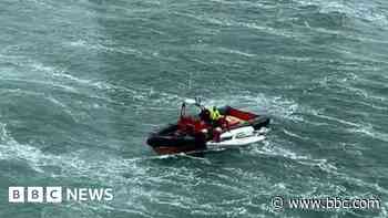 Sailor rescued after strong winds capsize dinghy