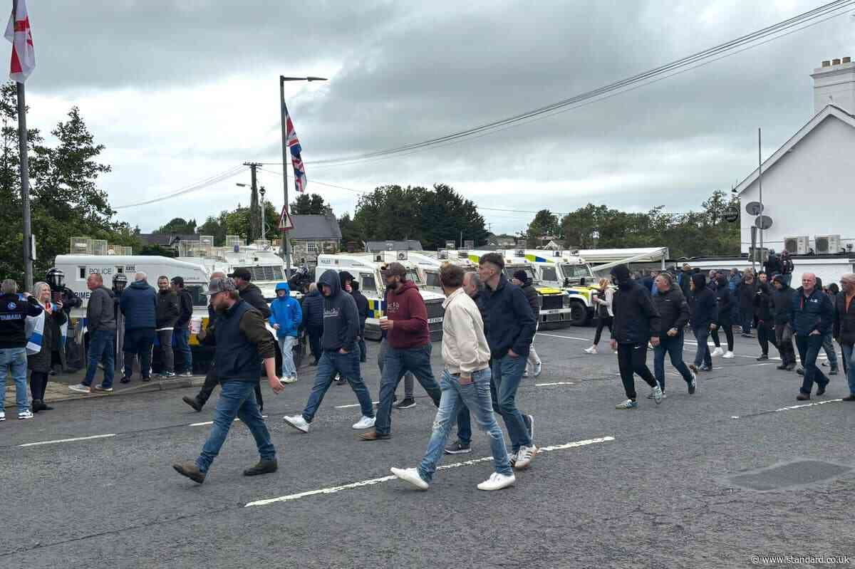 DUP MP defends photo with masked men at Scarva protest