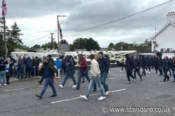 DUP MP defends photo with masked men at Scarva protest
