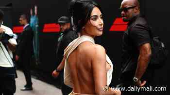 Kim Kardashian consoles boyfriend Lewis Hamilton after he places second at the Monaco Grand Prix after turning the grid into a red carpet in a daring backless dress