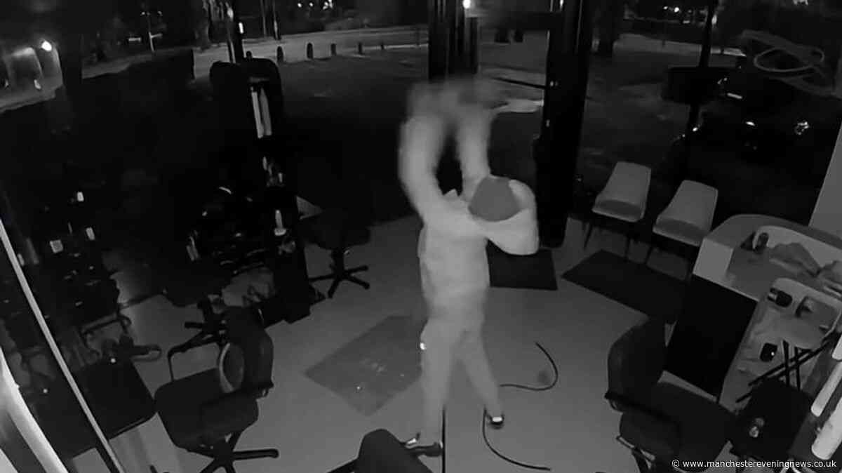 Disturbing CCTV shows 'man on rampage' as Salford salon torn up by hooded thug