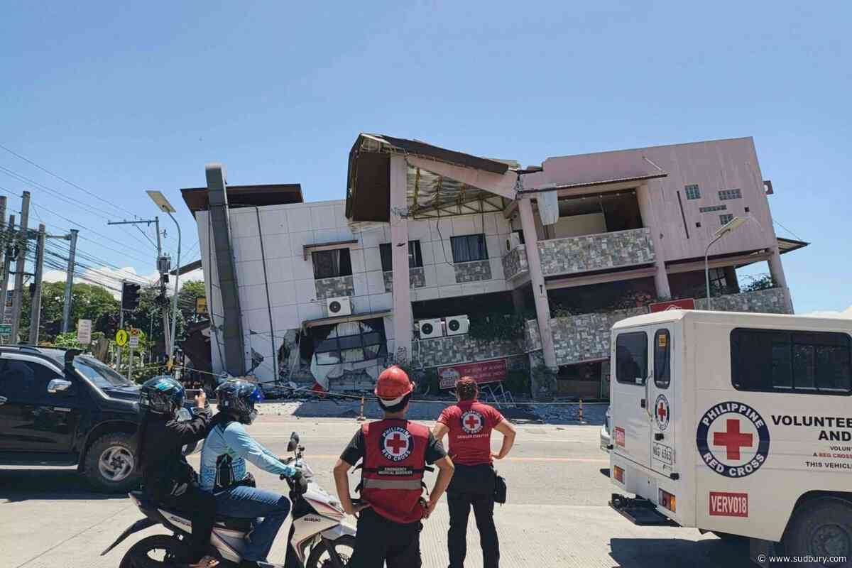 A 7.8 magnitude quake in the Philippines kills at least 16, fells buildings and sets off a tsunami