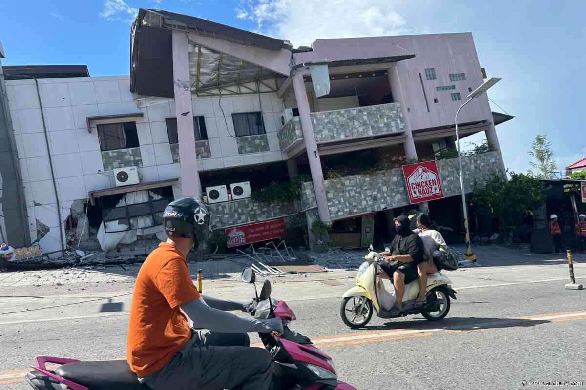 A 7.8 magnitude quake in the Philippines kills at least 32, fells buildings and sets off a tsunami