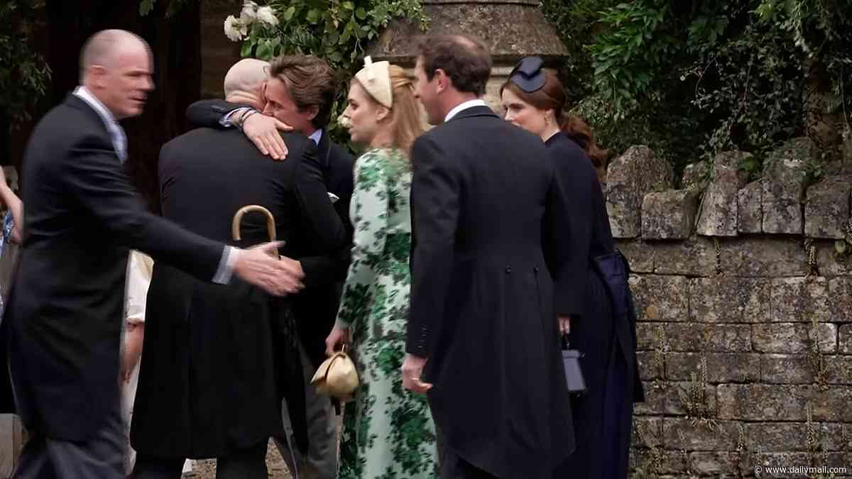 Beatrice and Eugenie welcomed back in the fold by Mike Tindall: Ex-rugby ace led the way in greeting the York sisters and wrapped Edo in a bear hug